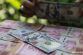 Key Strategy: Rupiah Lesu ke Rp17.667 Imbas Kekhawatiran akan BUMN Ekspor